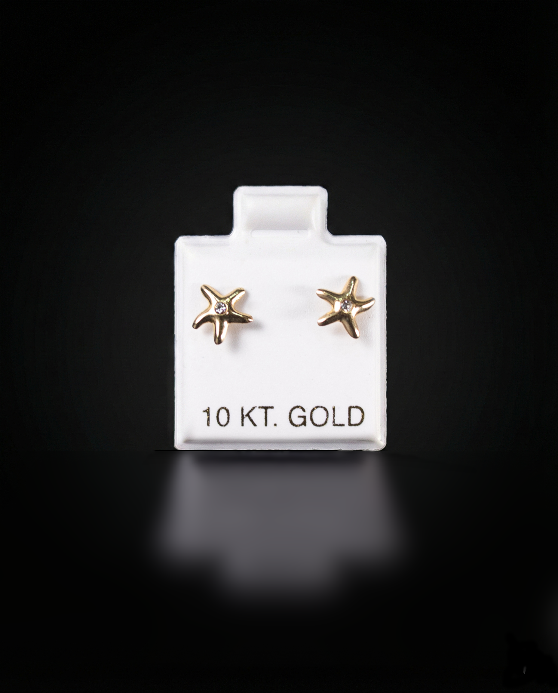 Aretes estrella con zirconias blancas 10k