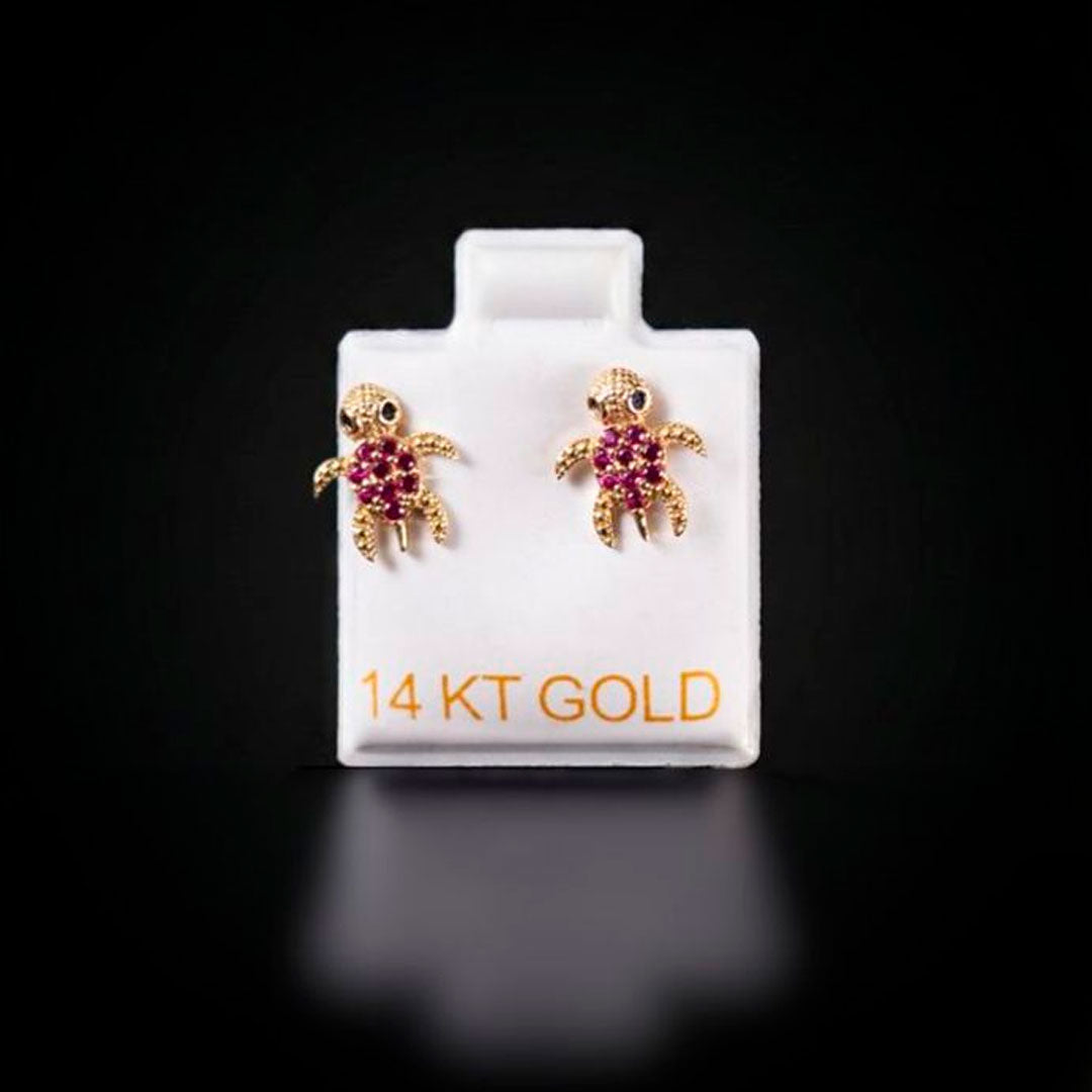 Aretes tortuga con zirconias fucsias 14k