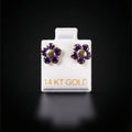 Arete flor con zirconias moradas 14k